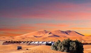 Camp site over sand dunes in Merzouga, Sahara desert, Morocco, Africa