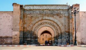 Massive gate in medieval city walls of Marrakech, Morocco