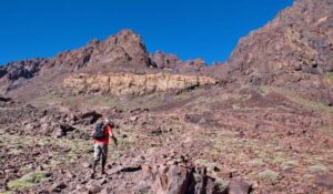 Senior man is hiking in High Atlas mountains in Morocco