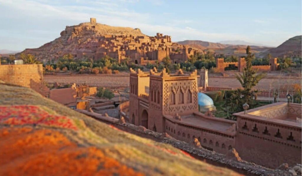 The 3 day tour Marrakech to Merzouga is one of the most remarkable trips, combining the city's charm with authentic desert traditions. The journey begins in the vibrant city of Marrakech, passes through the majestic Atlas Mountains, and reaches the golden sand dunes of Merzouga, where you can experience authentic Bedouin life and enjoy the enchanting atmosphere of the desert. What Is Included in the 3 Day Tour Marrakech to Merzouga? The 3 day tour Marrakech to Merzouga is one of the best travel experiences in Morocco that allows visitors to experience the country's natural and cultural diversity in just three days: Day 1: From Marrakech to Dades Valley via Ait Benhaddou and Oued El Ward The first day begins with an early morning pick-up from Marrakech, where participants will depart by car or bus through the picturesque Tizi n'Tichka Pass in the High Atlas Mountains. During the journey, you will enjoy enchanting views of mountain peaks and green valleys. The first official stop is in the famous village of Ait Benhaddou. The journey then heads to the Valley of the Roses region in Kelaat M'Gouna, passing by the Valley of the Roses, famous for its annual rose festival and natural beauty. A stop in the Dades Valley is followed by an overnight stay at a comfortable hotel, where you'll have dinner and prepare for the next day. Day 2: From Dades Valley to Merzouga via Todgha Gorge and Khamlia The second day begins with breakfast in the Dades Valley, before heading to the Todgha Gorge. This deep mountain pass with its steep steps reflects the natural beauty of Morocco. You can hike the gorge or take photos of the stunning landscape. The journey then heads to Erfoud, where you can visit traditional craft workshops, particularly fossil-making, and meet local artisans. In the evening, arrive in Merzouga in the Erg Chebbi desert, where you will begin a camel ride across the sand dunes to the desert camp. Here, you will spend the night in a traditional tent furnished with comfortable beds and warm blankets. Day 3: Sunrise in the Desert, Visit Khamlia and Rissani Villages, then Return to Marrakech The third day begins with sunrise over the desert dunes, where you can take a camel ride to witness the breathtaking dawn view, an unforgettable experience for any visitor. Next, head to the traditional Rissani market, where you can discover the daily lives of locals, learn about traditional Moroccan products, and perhaps sample some authentic Moroccan dishes. In the afternoon, begin your journey back to Marrakech, passing once again through the Atlas Mountains and the Tadart region, with short stops for rest and photo opportunities. Arrive in Marrakech in the evening, completing your 3-day tour of Marrakech to Merzouga, which combines culture, nature, and desert adventure in a unique experience. Are the Desert Camps Comfortable During the Overnight Stay? Of course, the organizers of the 3-day tour Marrakech to Merzouga are keen to provide visitors with optimal comfort during their stay in the desert. Traditional desert camps are often equipped with large, insulated tents, with comfortable beds and warm blankets, as it can be chilly at night. Are There Opportunities to Meet Local Barber Communities During the Tour? Yes, the 3 day tour from Marrakech to Merzouga desert features opportunities to interact with the authentic Berber communities living in the Atlas Valley and the Sahara. During the trip, visitors will visit traditional Berber villages, where they will be welcomed with warm hospitality, served Berber-style breakfasts, and have the opportunity to learn about daily life, handicrafts, and folk stories. Read more: Berber People Sahara Is the 3 Day Tour Marrakech to Merzouga Suitable for Families? Yes, this tour is an ideal choice for families seeking a unique and safe experience in Morocco. Suitable for all ages, the trip offers a variety of activities, such as camel riding in the desert, wandering through traditional markets, and visiting historical and natural sites. Organizers typically consider the comfort of children and the elderly, providing comfortable transportation and balanced programs suitable for all family members. In conclusion, the 3 day tour Marrakech to Merzouga is one of the best tourist experiences in Morocco, combining natural beauty, cultural heritage, and desert adventures. Whether you're traveling alone, with family, or with friends, this tour offers an unforgettable experience from the heart of Marrakech to the depths of the Merzouga desert. We’d love to have you with us, join the tour now and get ready for a unique journey that combines adventure, culture, and nature. People Also Ask How Long Is the Drive from Marrakech to Merzouga? The drive takes about 7 to 8 hours, with stops for rest and sightseeing along the way. What Type of Transportation Is Used During the Tour? Air-conditioned 4x4 vehicles or comfortable minibuses suitable for mountain and desert roads are used. What Should I Pack for the 3 Day Tour from Marrakech to Merzouga Desert? Bring comfortable, light clothing for the day, and warm clothing for the night due to the low temperatures in the desert, in addition to sunscreen, a hat, water, and basic personal items.